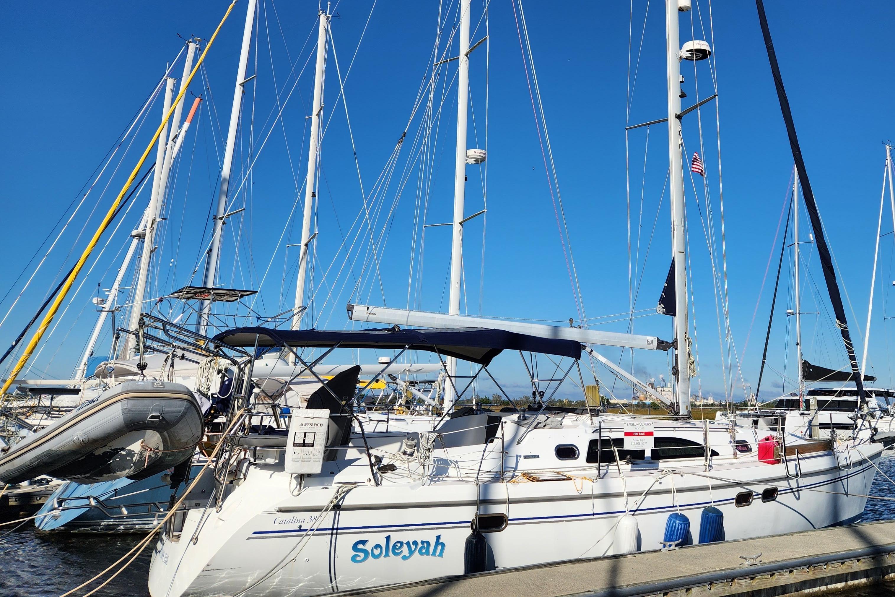 Catalina 387 Sailboat Catalina 387, 2007 model, docked at marina under clear blue sky.
