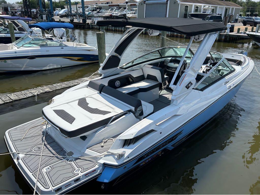 Monterey 298 Super Sport 2022 Monterey 298 Super Sport boat docked at marina, featuring sleek design and spacious seating.