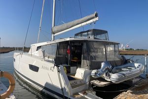 Fountaine Pajot Astrea 42 Catamaran 2024 Fountaine Pajot Astrea 42 catamaran docked with inflatable boat attached.