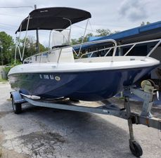 Bayliner Element F18 2017 Bayliner Element F18 boat on trailer with canopy, parked outdoors.