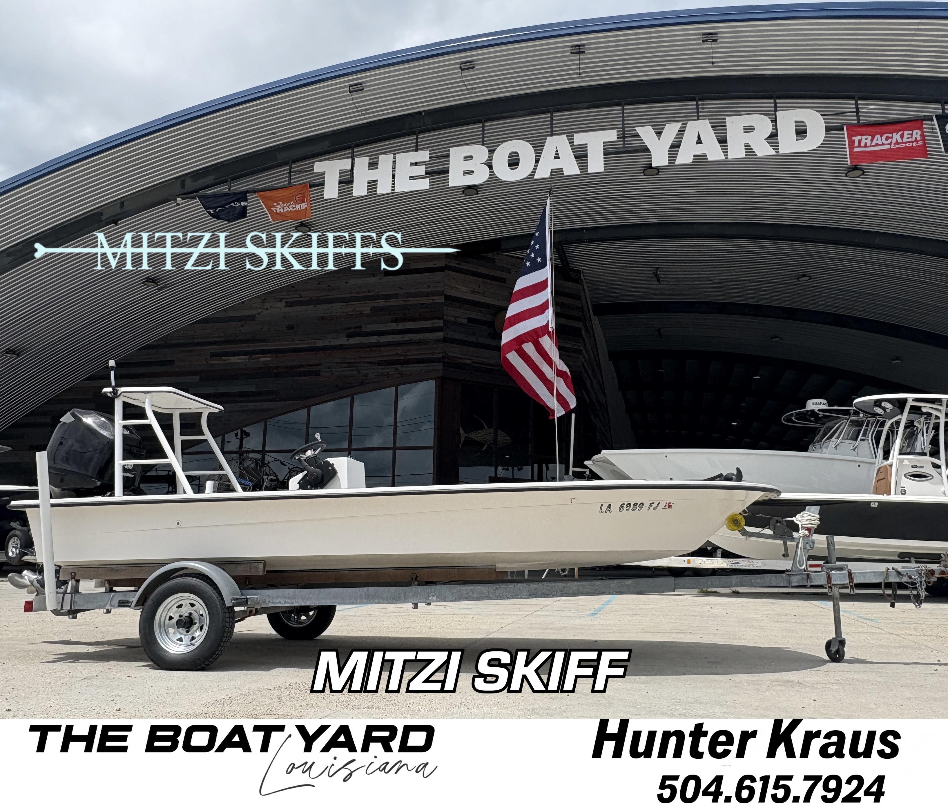 Custom Mitizi Skiff 17 2004 Custom Mitzi Skiff 17 boat at The Boat Yard, Louisiana, with American flag.