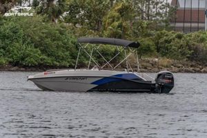 Starcraft SVX 171 OB 2023 Starcraft SVX 171 OB boat on water, featuring sleek design and canopy.
