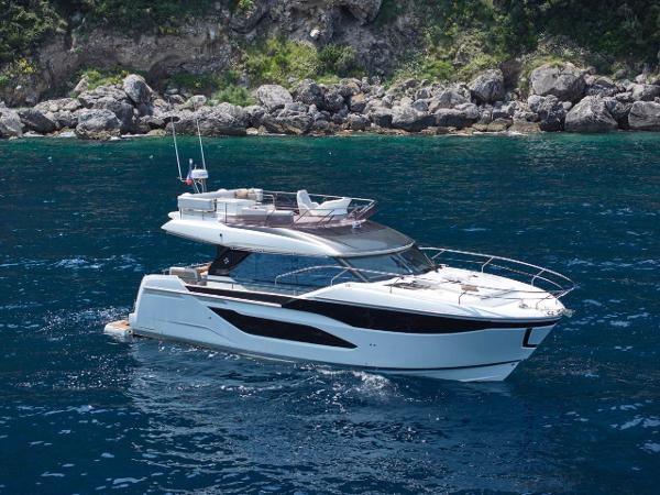 Prestige F4.9 Luxury Prestige F4.9 yacht cruising in clear blue waters, 2025 model.