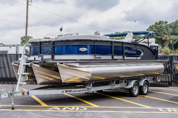 Manitou 23 Encore 2022 Manitou 23 Encore pontoon boat on EZ Loader trailer.