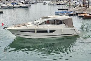 Jeanneau Leader 10 2014 Jeanneau Leader 10 yacht docked in a marina with other boats.