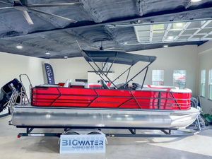 Berkshire CTS 2025 Berkshire CTS pontoon boat in showroom, vibrant red design, displayed at Big Water Marine.