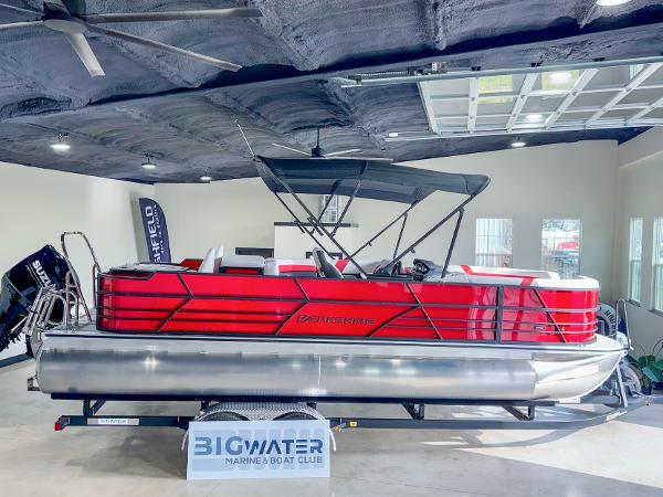Berkshire CTS 2025 Berkshire CTS pontoon boat in showroom, vibrant red design, displayed at Big Water Marine.