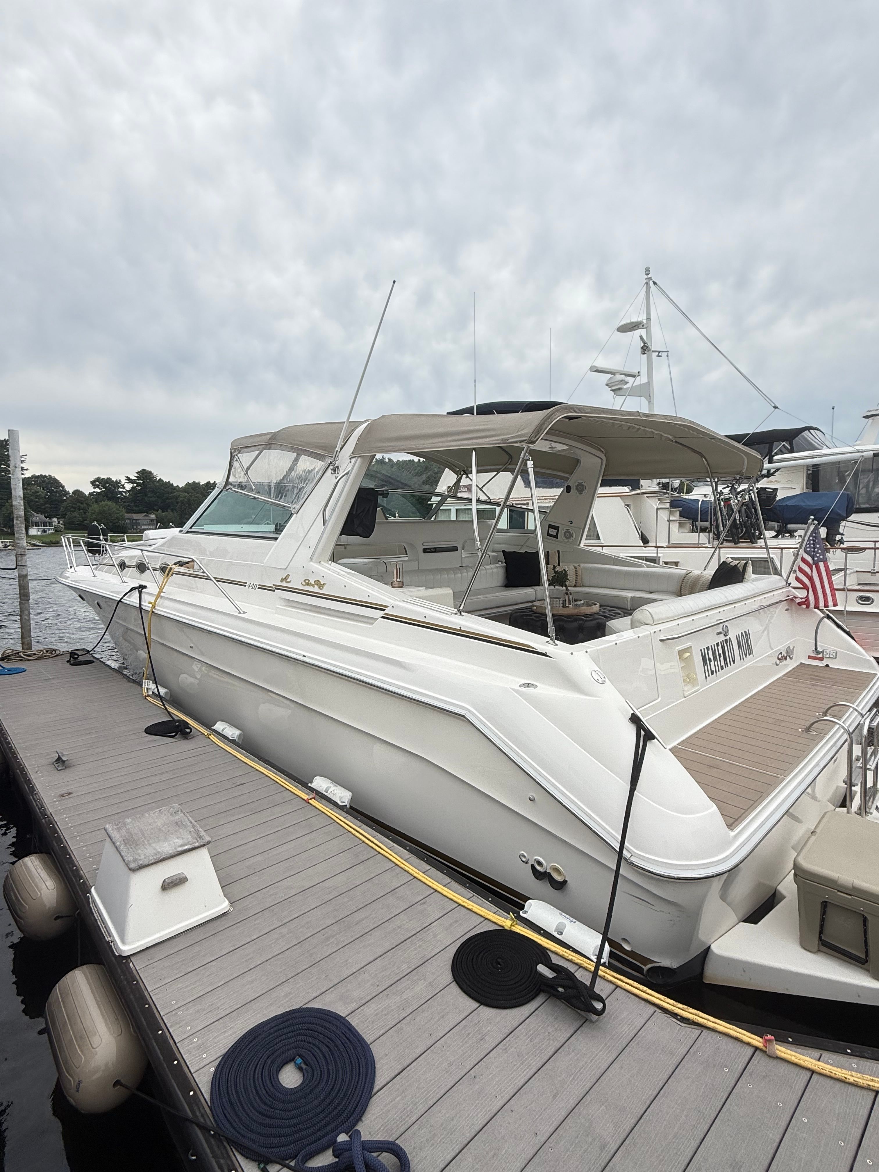 Sea Ray Sundancer 440 1994 Sea Ray Sundancer 440 yacht docked at marina under cloudy sky.