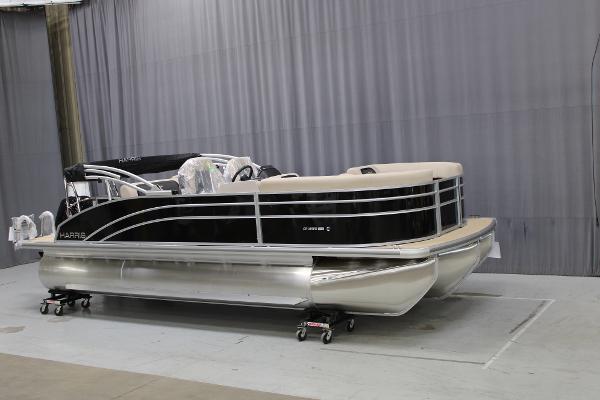 Harris Cruiser 210 2025 Harris Cruiser 210 pontoon boat in showroom, black and beige design.