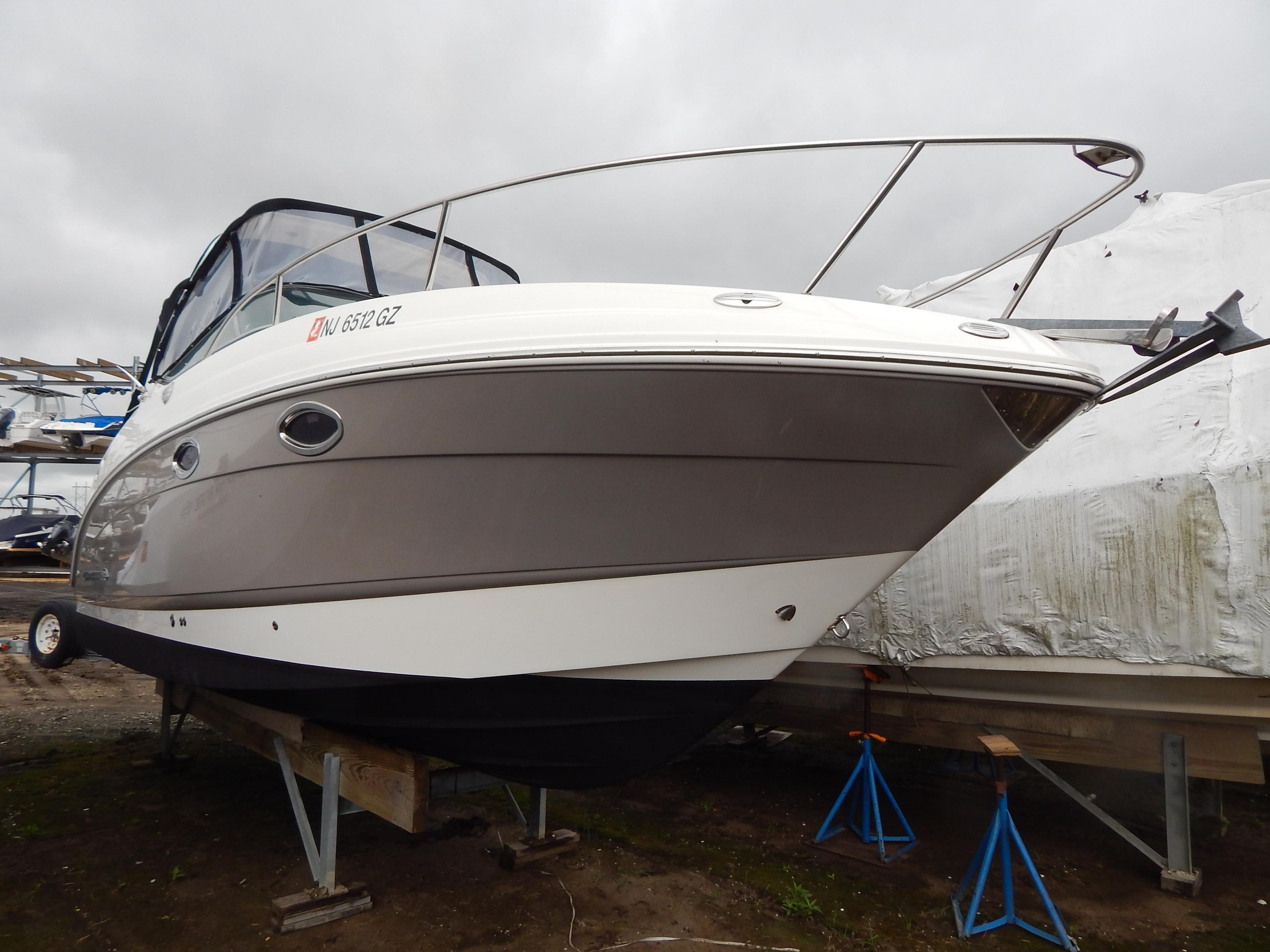 Chaparral Signature 250 2007 Chaparral Signature 250 boat on stands, overcast sky background.