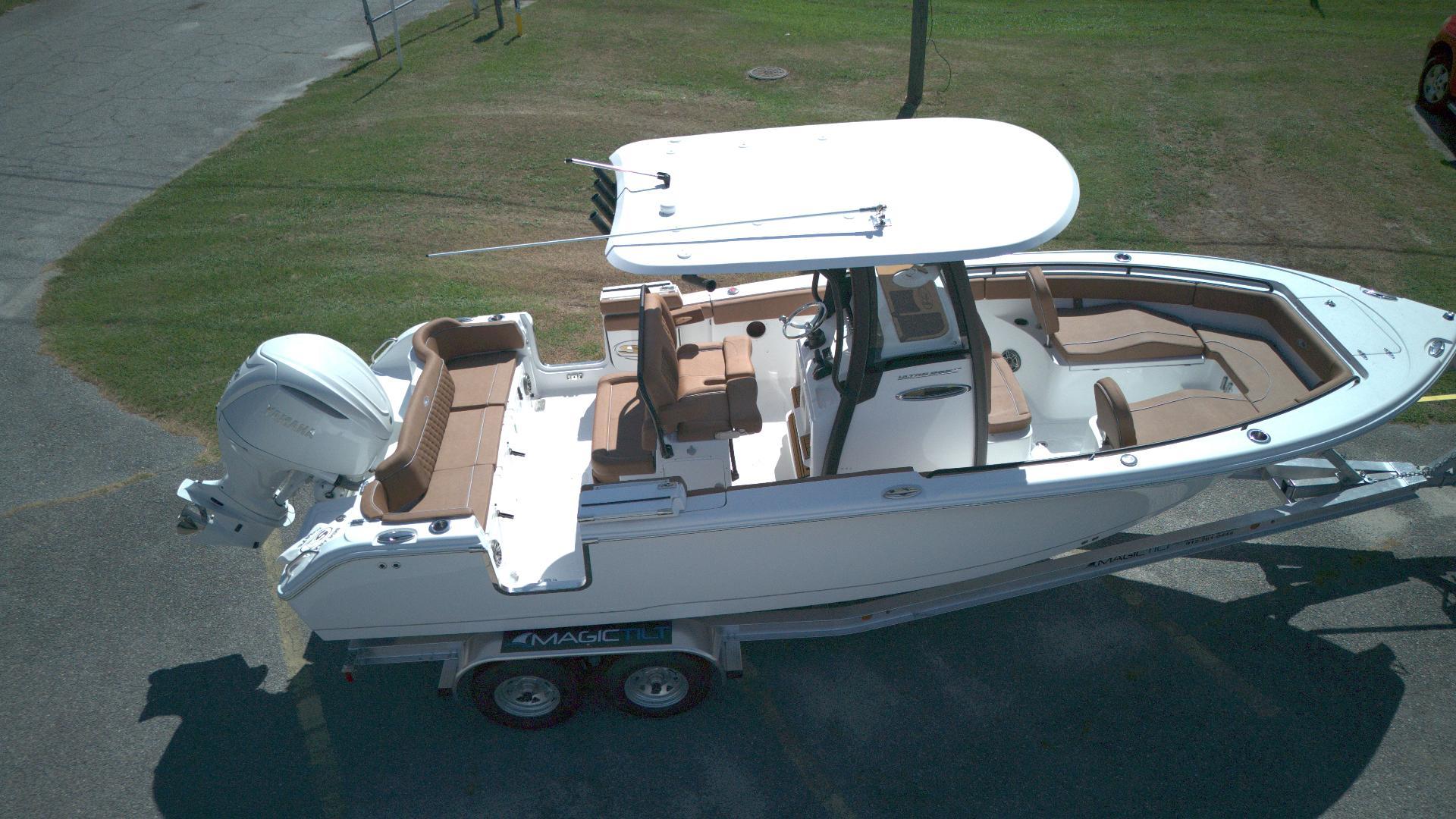 Sea Hunt Ultra 255 SE 2025 Sea Hunt Ultra 255 SE boat on trailer, aerial view.