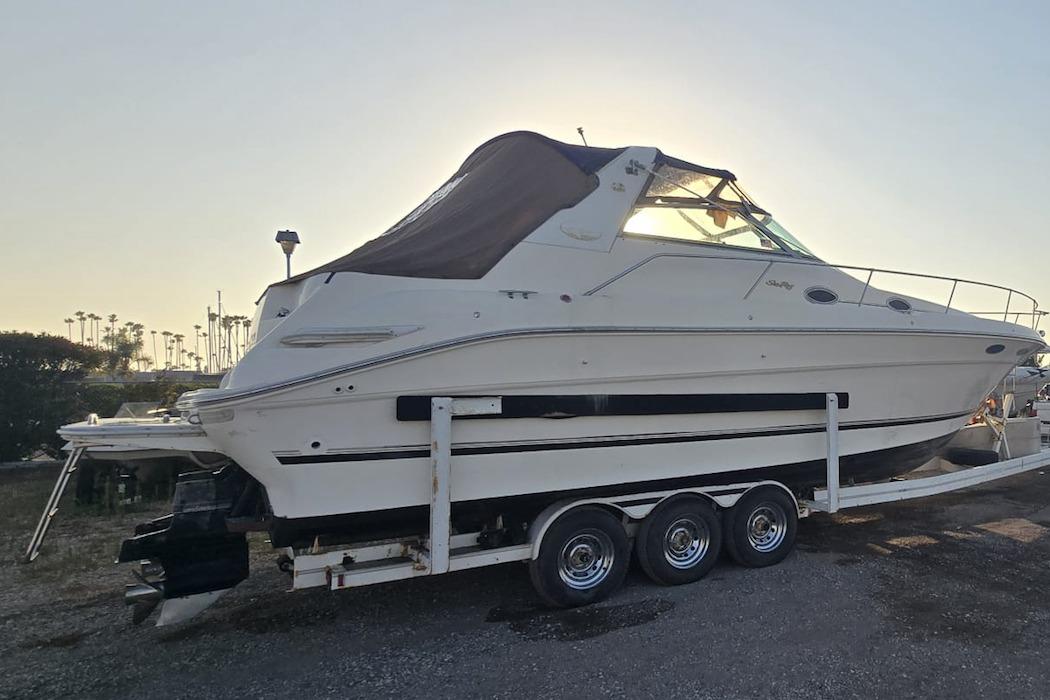 Sea Ray Sundancer 330 1996 Sea Ray Sundancer 330 boat on trailer, side view, parked outdoors.
