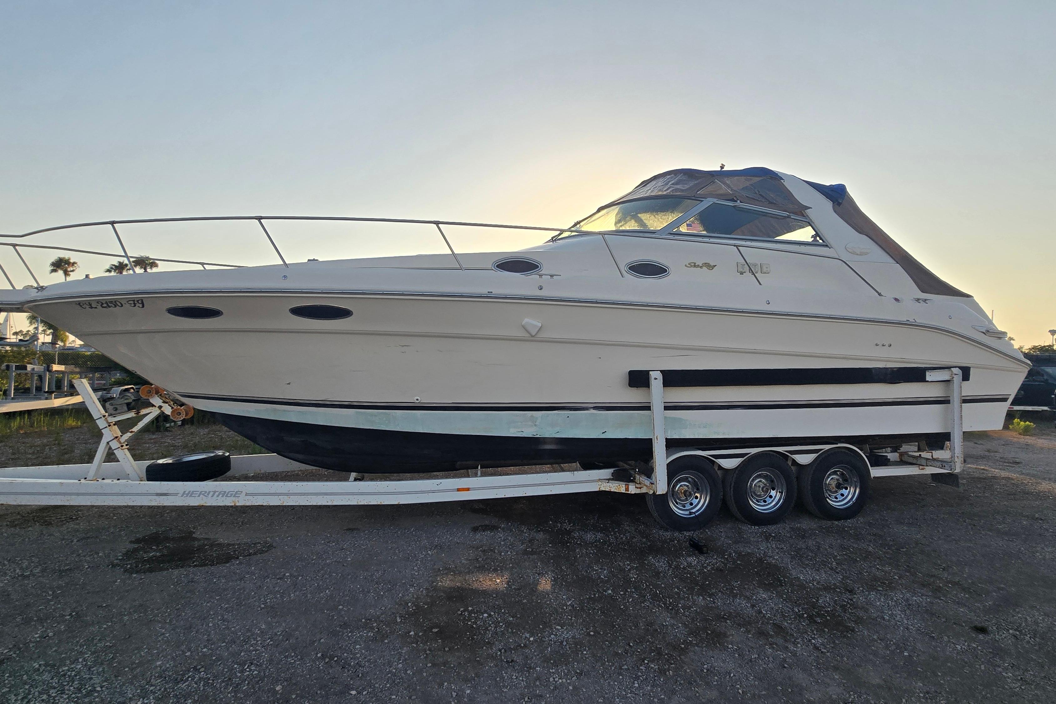 Sea Ray Sundancer 330 1996 Sea Ray Sundancer 330 boat on trailer, side view, parked outdoors.