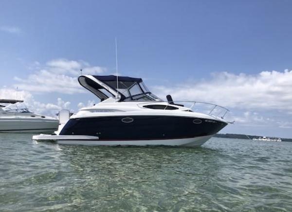 Regal 30 Express 2017 Regal 30 Express boat on calm water under a clear sky.