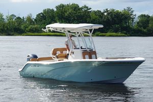 Sea Fox 226 Commander 2018 Sea Fox 226 Commander boat on calm water with lush green shoreline.