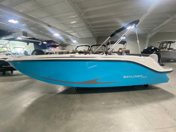 Bayliner Element M19 2024 Bayliner Element M19 boat in showroom, blue hull, white interior, black canopy.