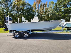 May-Craft 208 CC 2023 May-Craft 208 CC boat on trailer, parked outdoors.