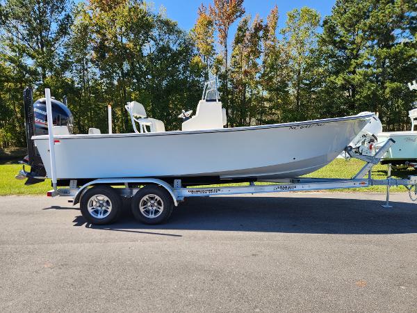 May-Craft 208 CC 2023 May-Craft 208 CC boat on trailer, parked outdoors.