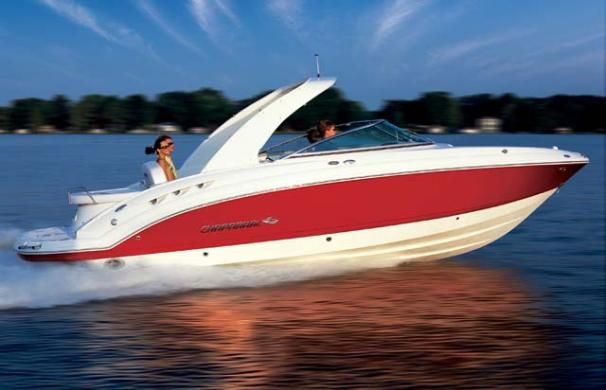 Chaparral SSX 276 2007 Chaparral SSX 276 speedboat cruising on a calm lake at sunset.