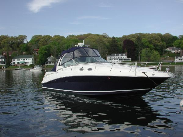 Sea Ray 340 Sundancer 2005 Sea Ray 340 Sundancer yacht on calm water, surrounded by lush greenery.