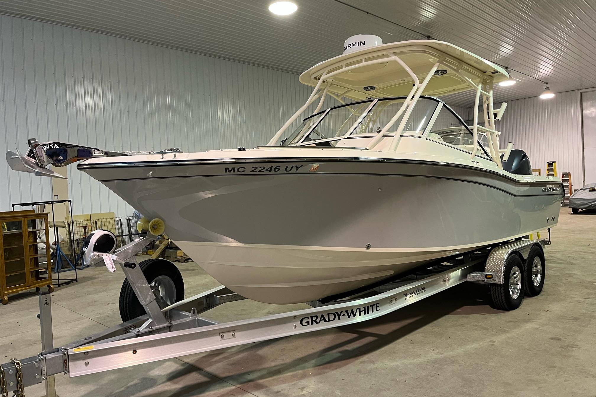 Grady-White Freedom 255 2023 Grady-White Freedom 255 boat on trailer in indoor storage facility.