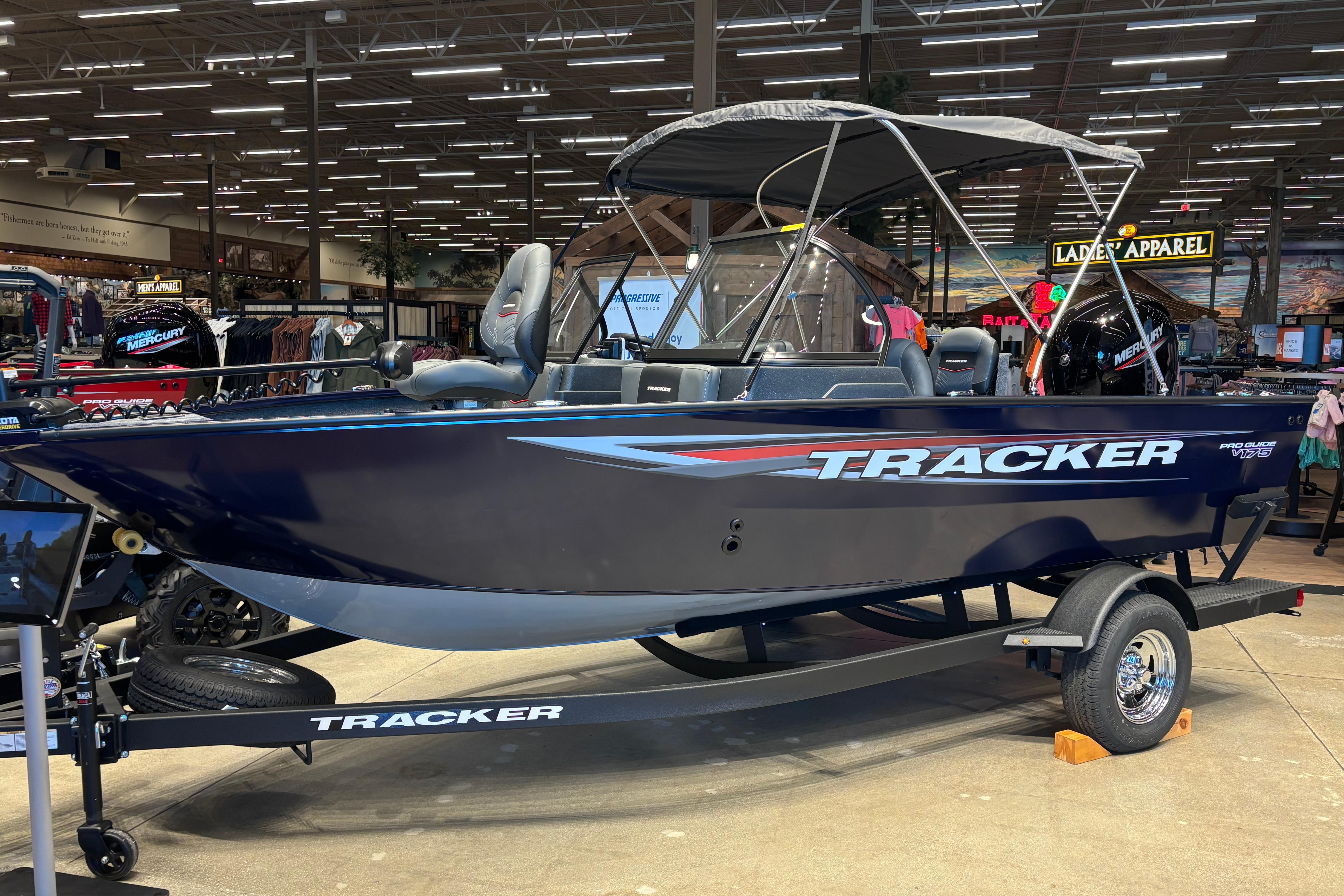 Tracker Pro Guide V-175 Combo 2026 Tracker Pro Guide V-175 Combo boat displayed indoors on a trailer.
