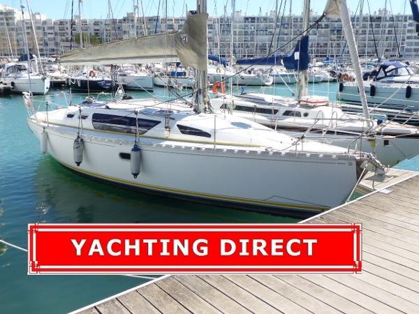 Jeanneau Sun Liberty 34 Jeanneau Sun Liberty 34 sailboat docked at marina, 1990 model, Yachting Direct banner.
