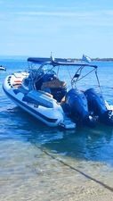 Ranieri Cayman 28 Executive Trofeo 2022 Ranieri Cayman 28 Executive Trofeo boat with dual engines on clear water.