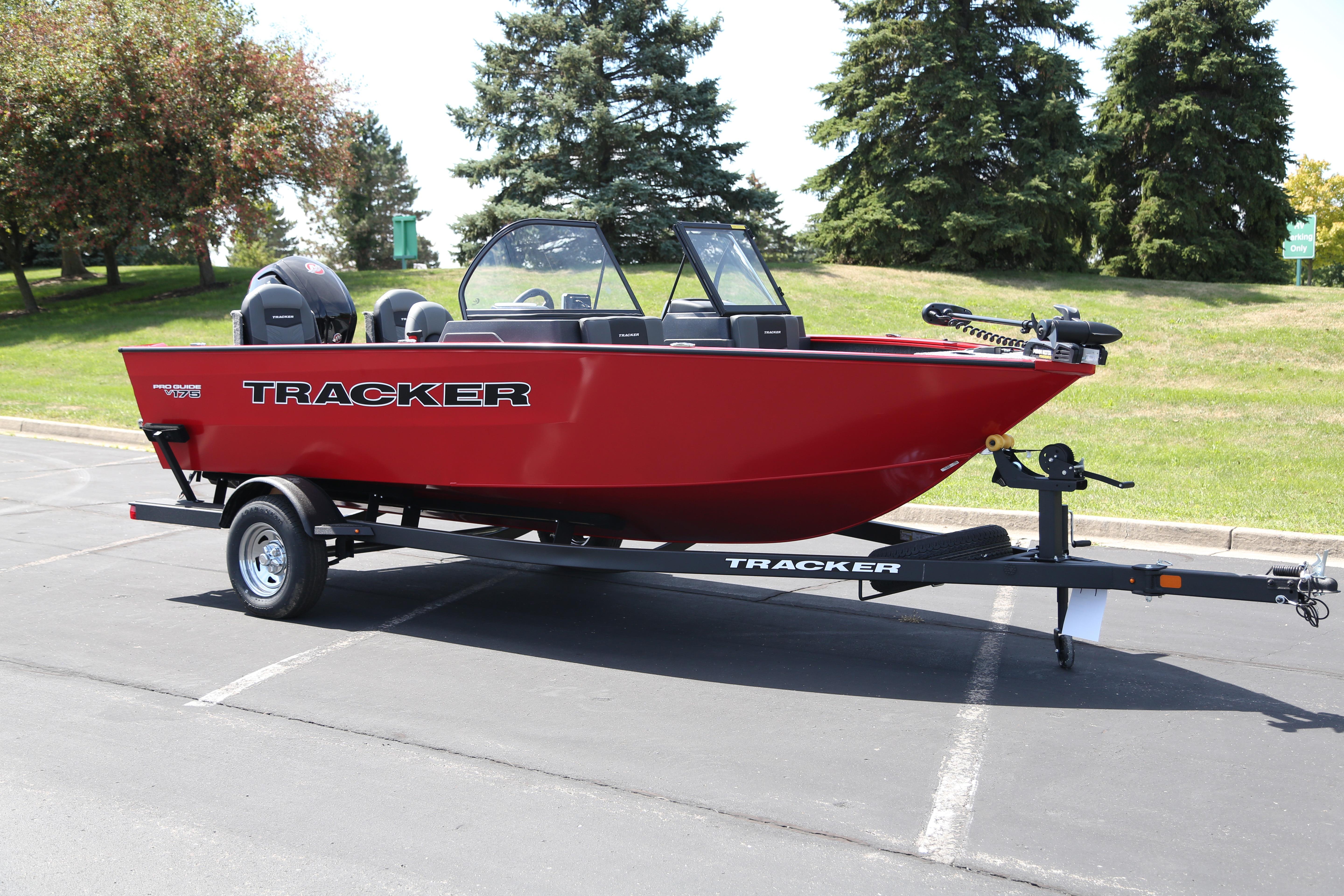 Tracker Pro Guide V-175 Combo 2026 Tracker Pro Guide V-175 Combo boat, red, on trailer in parking lot.