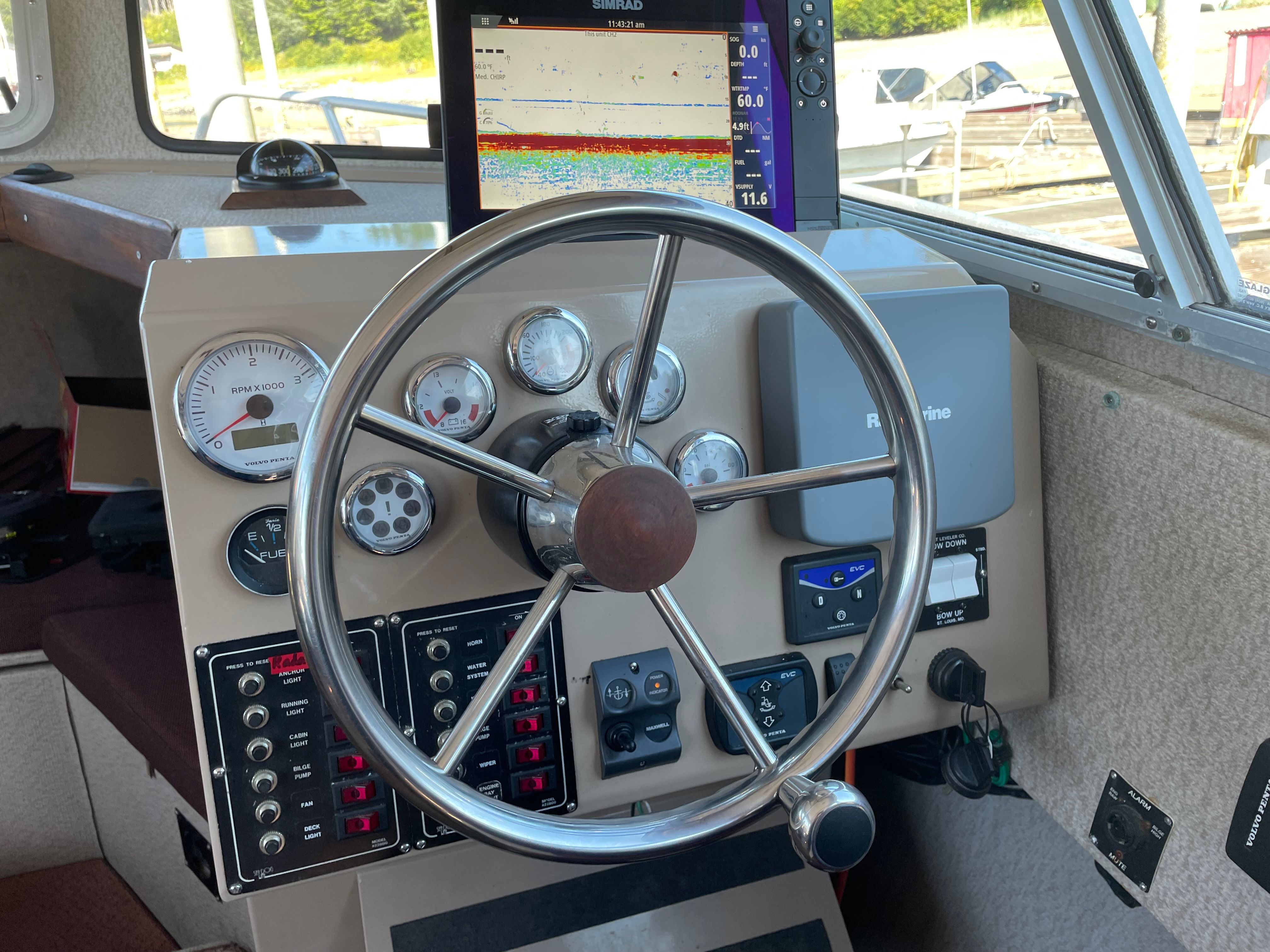 Lifetimer 3450 Boat dashboard with steering wheel, gauges, and navigation equipment, Lifetimer 3450, 2005 model.