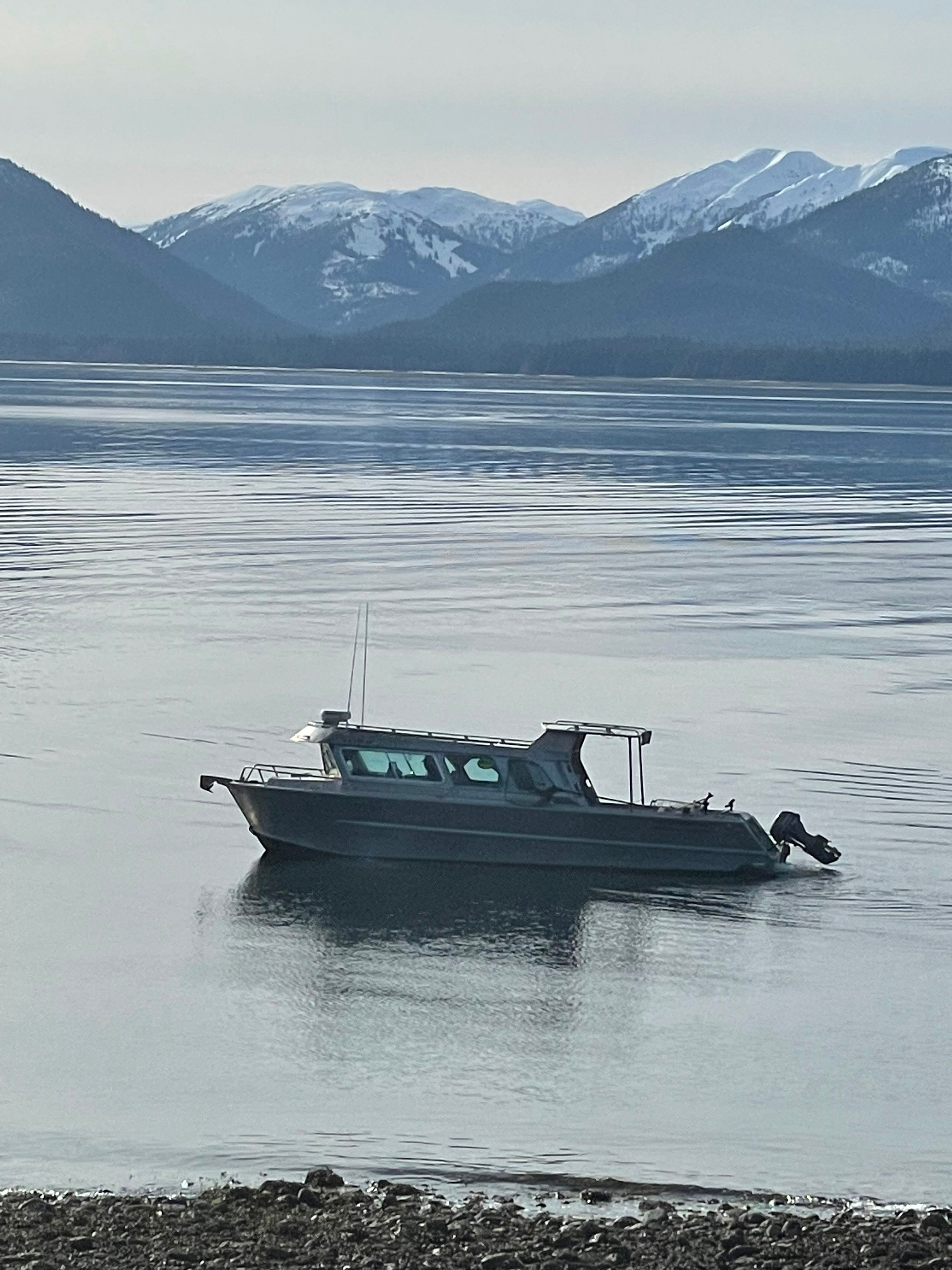 Lifetimer 3450 Boat on calm lake with snowy mountains in background, Lifetimer 3450, 2005 model.
