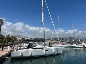 Jeanneau Sun Odyssey 349 2024 Jeanneau Sun Odyssey 349 sailboat docked in a marina under a clear blue sky.