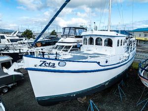 Diesel Duck 41-Plus 2009 Diesel Duck 41-Plus boat named Zeta in a marina setting.