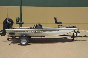 Tracker Pro 170 2026 Tracker Pro 170 boat on trailer, side view, beige color, outdoor setting.