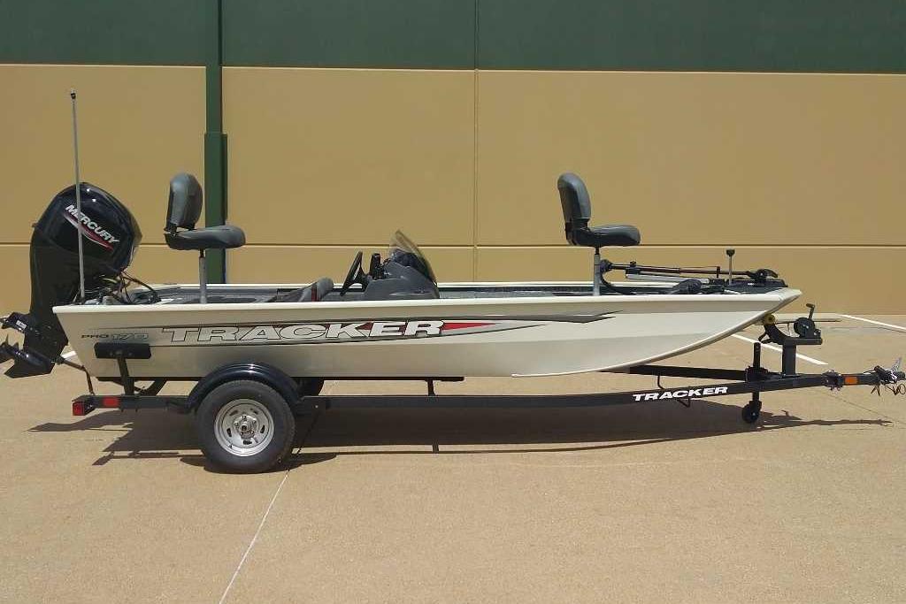 Tracker Pro 170 2026 Tracker Pro 170 boat on trailer, side view, beige color, outdoor setting.