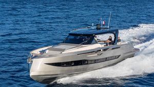 Cayman Yachts 540 wa 2024 Cayman Yachts 540 wa cruising on open sea, sleek design, luxury motor yacht.