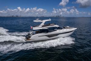 Galeon 500 Fly 2021 Galeon 500 Fly yacht cruising on open water under a clear blue sky.