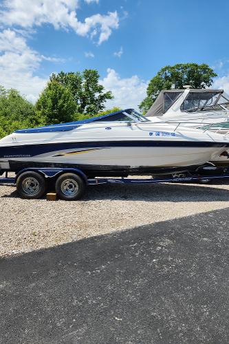 Chaparral 200 SSi Chaparral 2000 200SSI boat on trailer, parked outdoors on a sunny day.