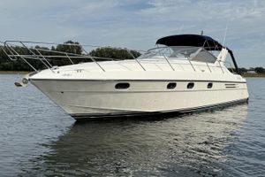 Princess 406 Luxury 1993 Princess 406 yacht on calm water, showcasing sleek design and elegance.