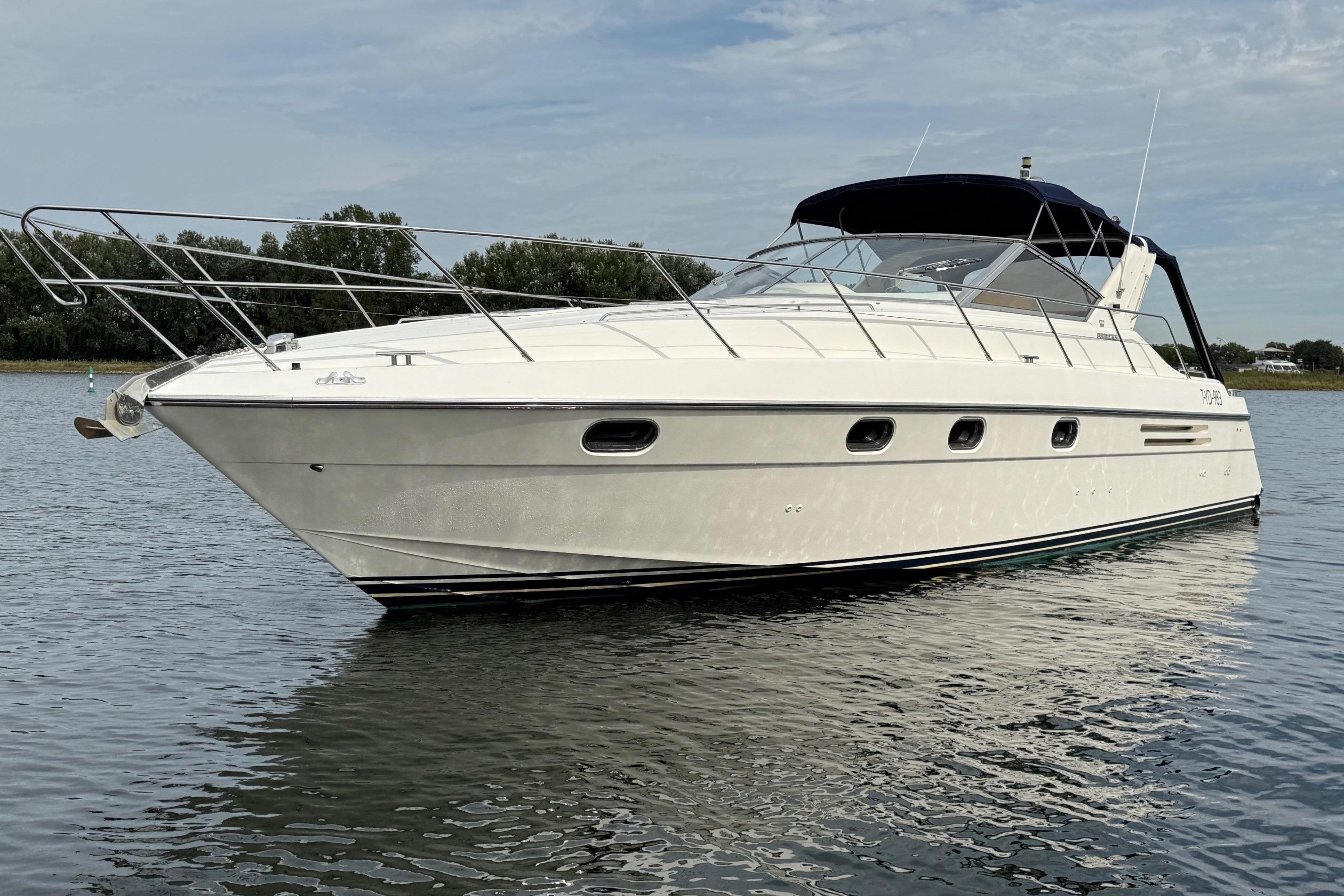 Princess 406 Luxury 1993 Princess 406 yacht on calm water, showcasing sleek design and elegance.