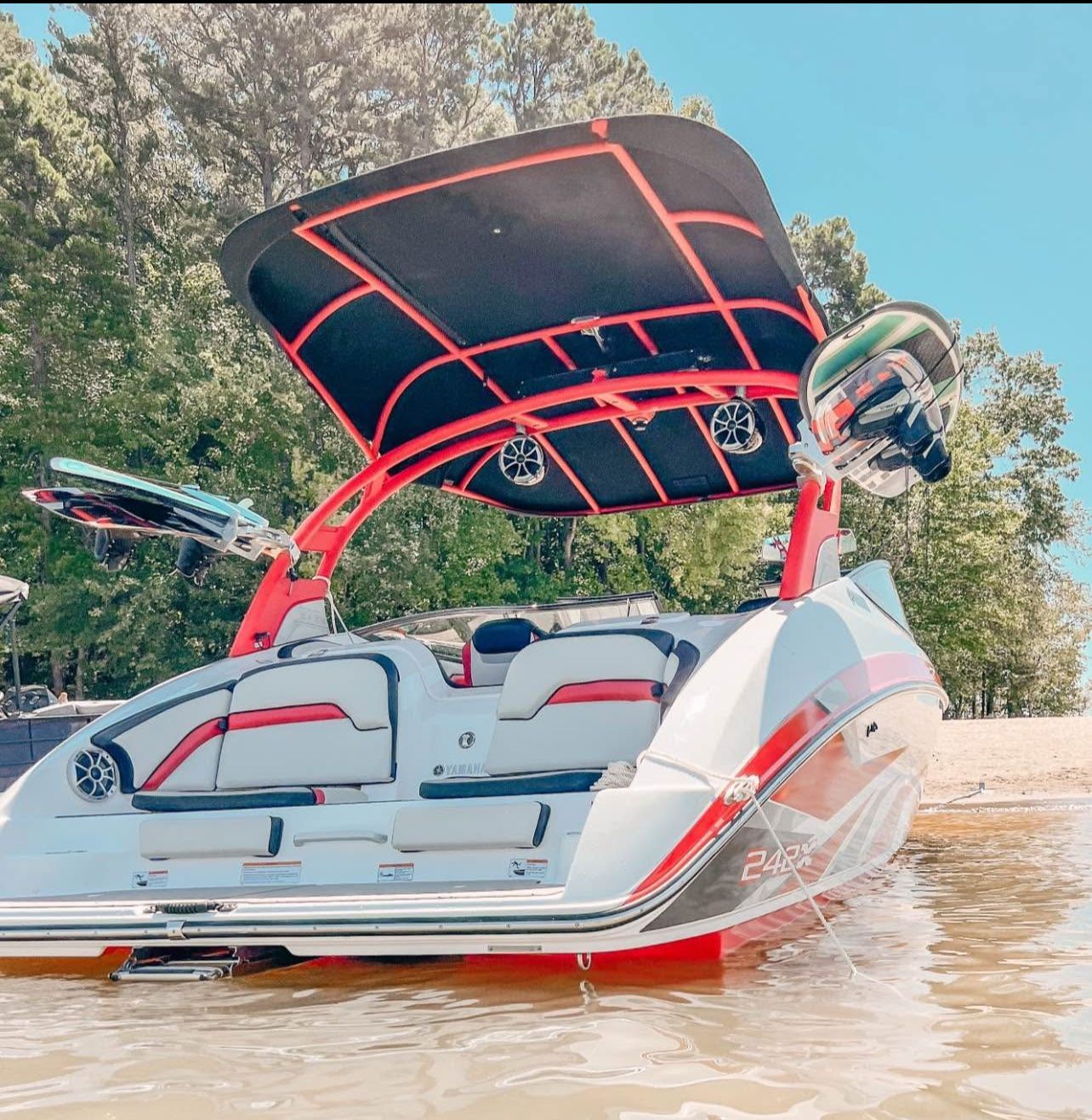 Yamaha Boats 242X 2020 Yamaha Boats 242X on water, featuring sleek design and vibrant red accents.