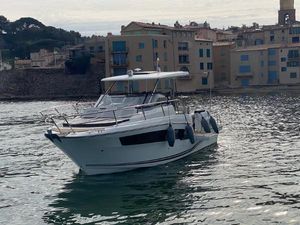 Jeanneau Cap Camarat 10.5 WA Serie 2 2021 Jeanneau CAP CAMARAT 10.5 WA S2 boat docked near waterfront buildings.