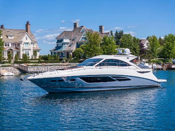 Sea Ray 510 Sundancer 2015 Sea Ray 510 Sundancer yacht cruising near waterfront homes.