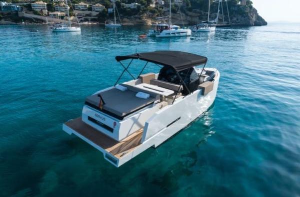 De Antonio Yachts D28 Open 2024 De Antonio Yachts D28 Open cruising in clear blue waters.