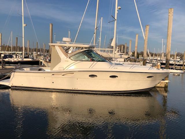 Tiara Yachts 3200 2005 Tiara Yachts 3200 docked in a marina, reflecting on calm water.