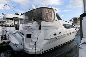 Sea Ray 40 Motor Yacht 2006 Sea Ray 40 Motor Yacht docked in marina, featuring sleek design and inflatable dinghy.