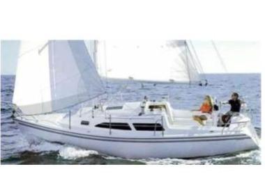 Catalina 270 2004 Catalina 270 sailboat cruising on open water with two people onboard.