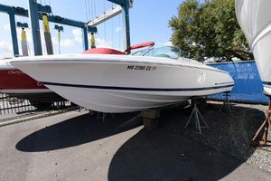 Chris-Craft Launch 22 2001 Chris-Craft Launch 22 boat on stands, white hull, outdoor display.