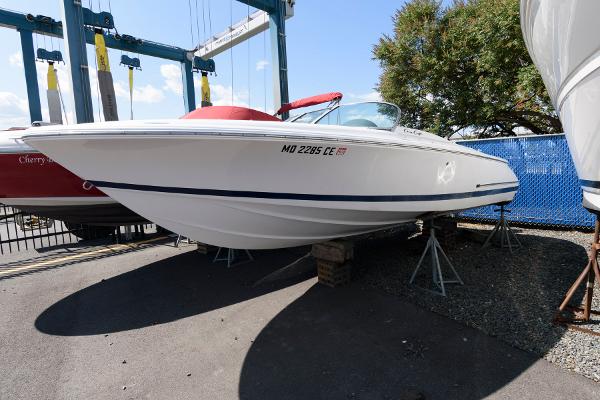 Chris-Craft Launch 22 2001 Chris-Craft Launch 22 boat on stands, white hull, outdoor display.