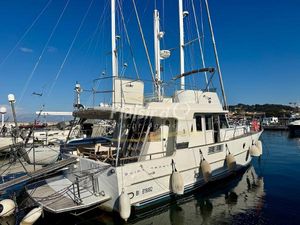 Beneteau Swift Trawler 42 2009 Beneteau Swift Trawler 42 docked in a marina under clear blue skies.